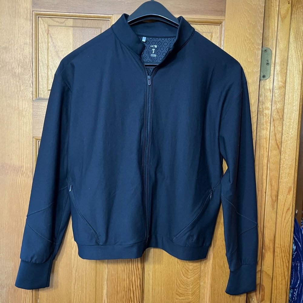women's black under armor light weight zip jacket. Medium
